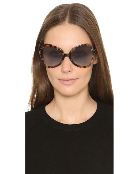 prada butterfly sunglasses black|Prada blue tortoise shell sunglasses.